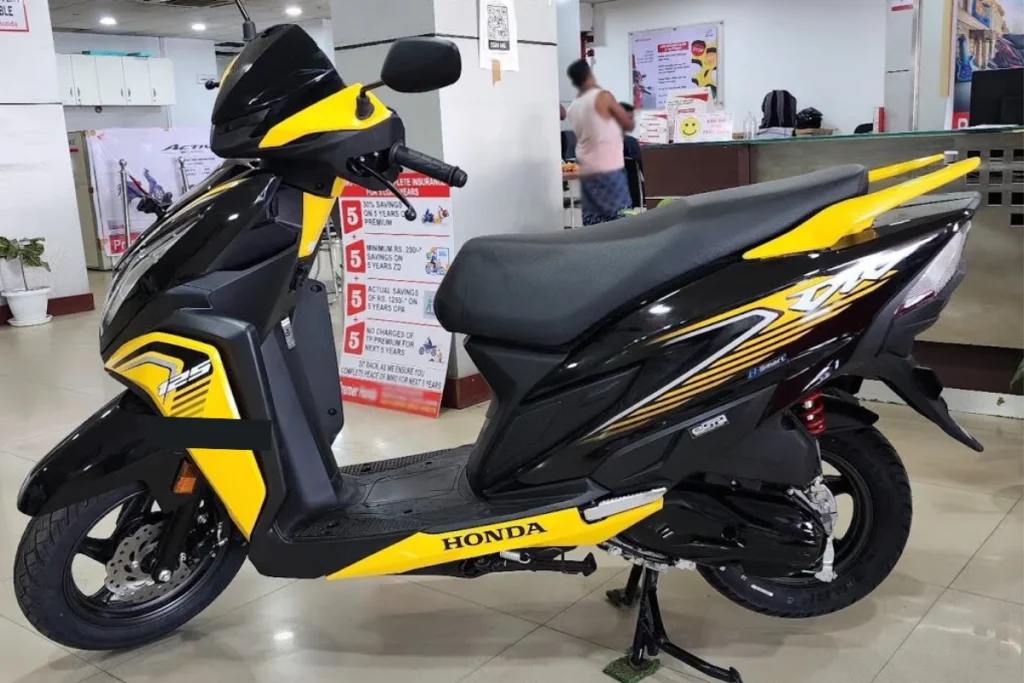 Honda Dio 2025: जबरदस्त लुक, स्मार्ट फीचर्स और दमदार परफॉर्मेंस का शानदार कॉम्बो मात्र ₹88,191 कीमत में